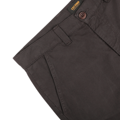 Close-up of the Liquorice Double Twisted Cotton Twill Fatigue Pants by C.O.F Studio, showcasing a single button and zipper, with side pockets and belt loops.