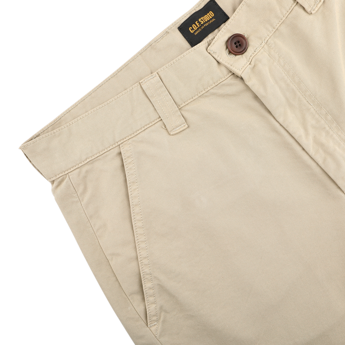 Sand Double Twisted Cotton Twill Fatigue Pants by C.O.F Studio, made from cotton twill in a beige hue, include belt loops and a brown button.