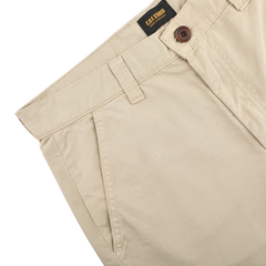 Sand Double Twisted Cotton Twill Fatigue Pants by C.O.F Studio, made from cotton twill in a beige hue, include belt loops and a brown button.