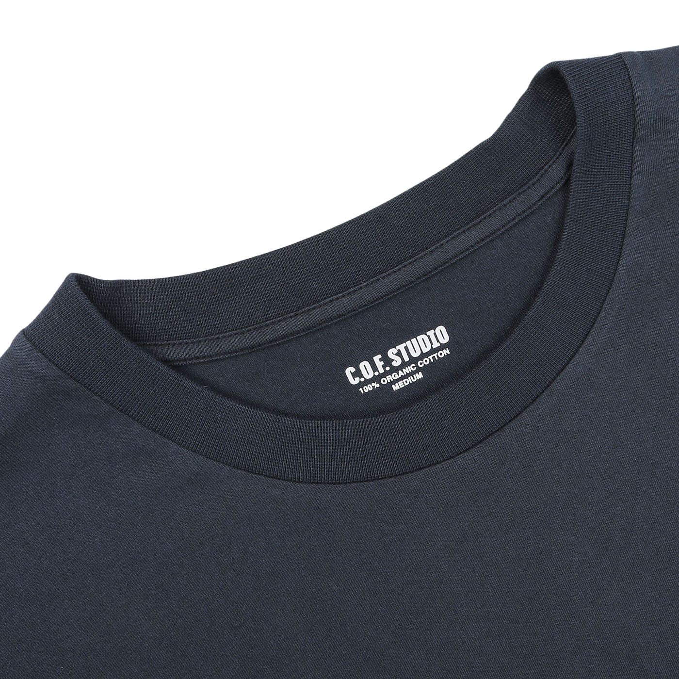 Close-up of the Navy Blue Organic Cotton Crewneck T-Shirt by C.O.F Studio, showcasing a label that reads "C.O.F. STUDIO 100% ORGANIC COTTON." The regular fit neckline and part of the shoulder area are visible.