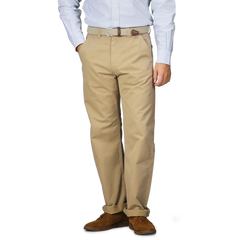 A person wearing a striped shirt, Khaki Double Twisted Cotton Twill Fatigue Pants from C.O.F Studio, and brown shoes is standing. The fatigue pants are secured with a textured belt.