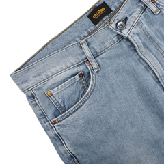 Light blue 90's wash organic cotton M8 jeans by C.O.F Studio with a straight roomy fit, front pocket, belt loops, and metal button at the waist, made from organic Kuroki Selvedge denim.