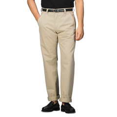 A person wearing C.O.F Studio's Sand Double Twisted Cotton Twill Fatigue Pants, accented with a black belt and shoes, stands with hands in pockets against a plain background.