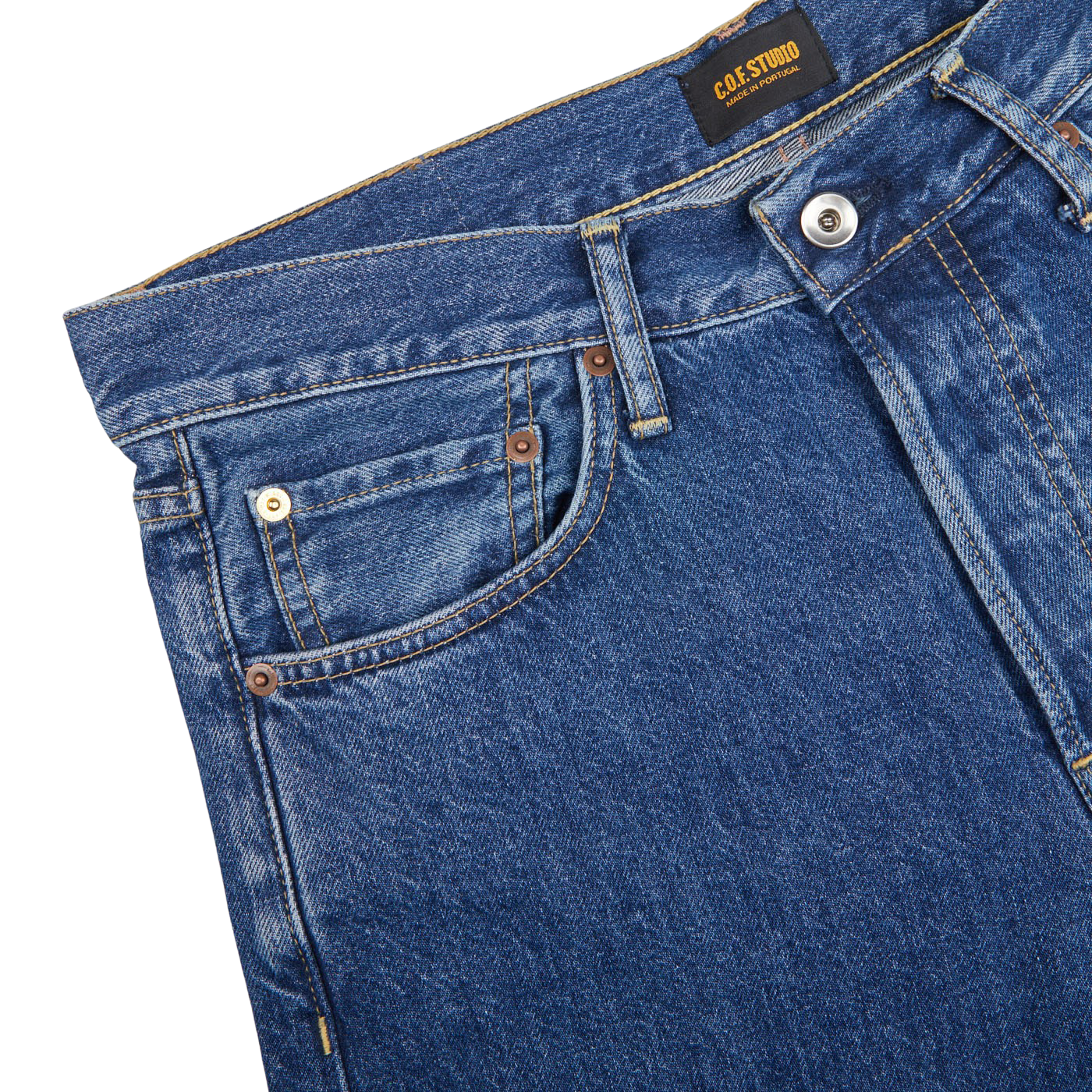 The tailored fit back pocket of a pair of C.O.F Studio Blue Organic Candiani Cotton M6 6x Wash Jeans.
