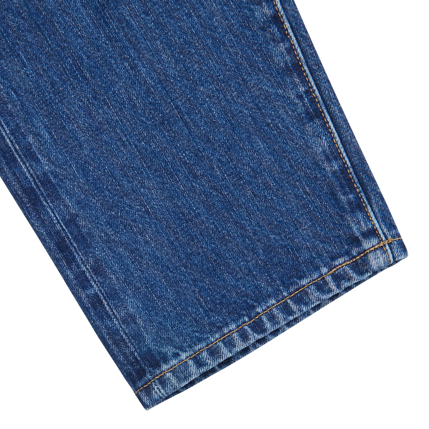 Close-up of C.O.F Studio Blue Organic Kurioki Cotton M7 6x Wash Jeans fabric, focusing on the hem and stitch details against a white background.