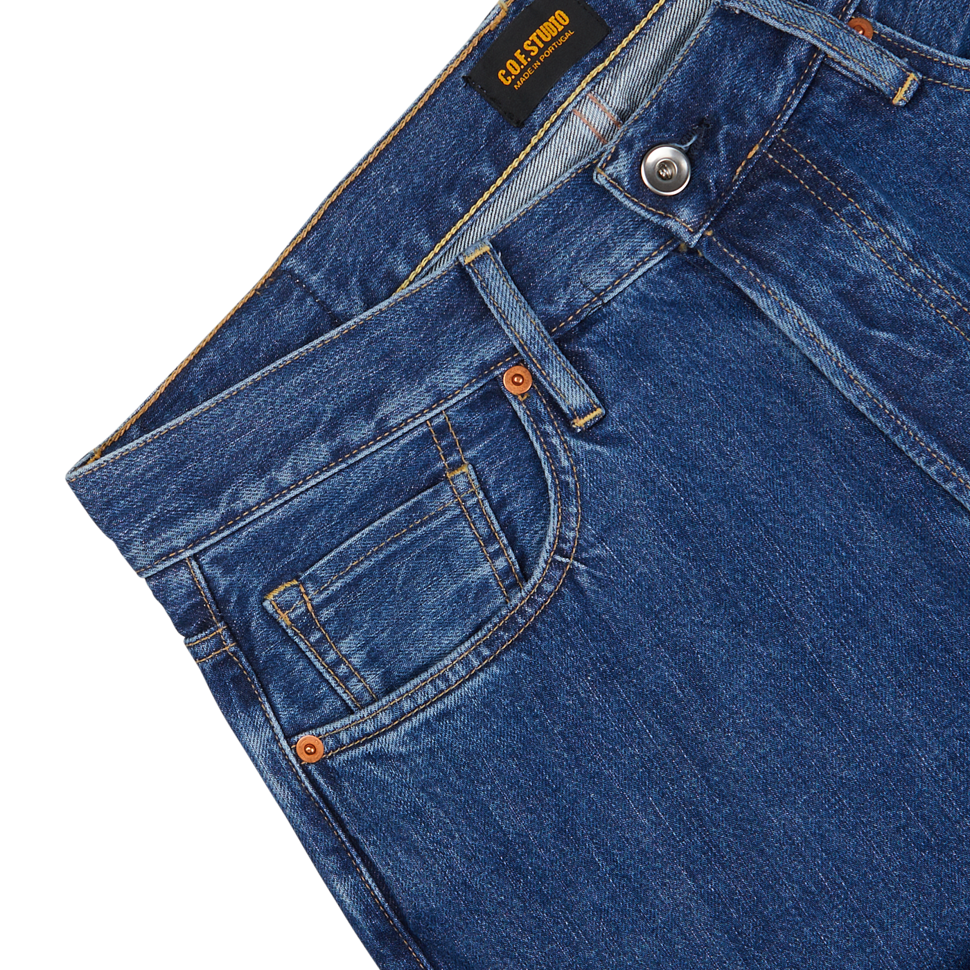 Close-up of washed Blue Organic Kurioki Cotton M7 6x Wash Jeans made by C.O.F Studio, displaying the front pocket, waistband, and button details against a neutral background.