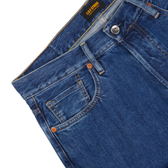 Close-up of washed Blue Organic Kurioki Cotton M7 6x Wash Jeans made by C.O.F Studio, displaying the front pocket, waistband, and button details against a neutral background.