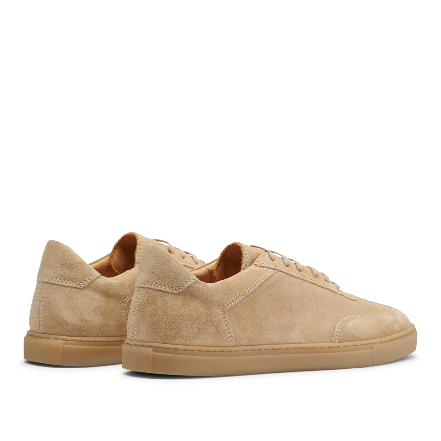 A pair of handmade Ambra Beige Suede Leather Otium sneakers with laces, displayed on a plain background by CQP.