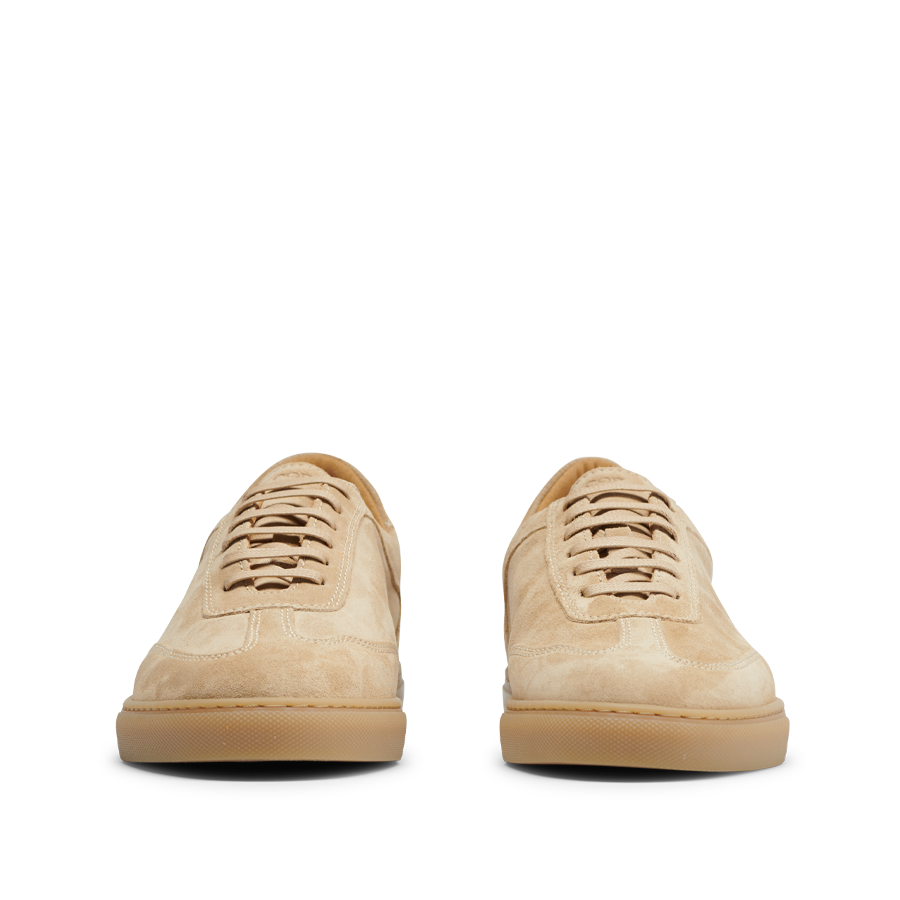 A pair of Ambra Beige Suede Leather Otium sneakers by CQP, low-top with laces, viewed from the front, set against a neutral background.