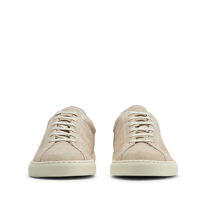 A pair of CQP Beige Suede Racquet Sneakers on a white background.