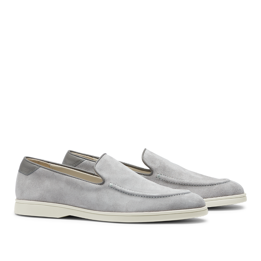 A pair of men's comfortable CQP Cement Grey Suede Leather Debonair Loafers with white soles.