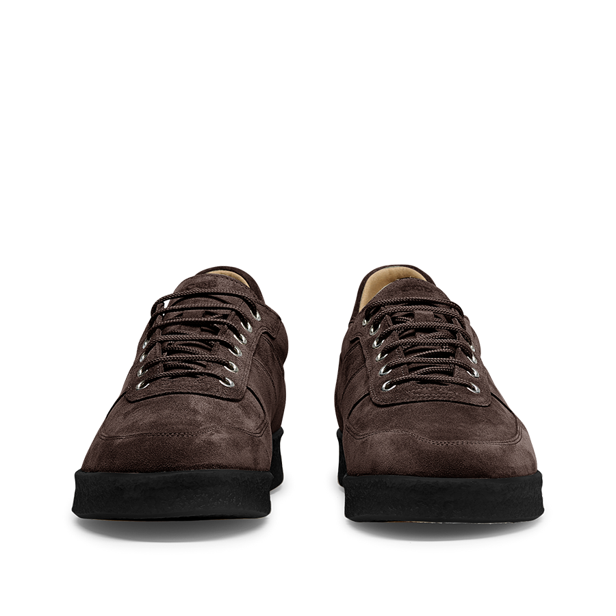 A pair of CQP Chocolate Brown Suede Leather Roamer Sneakers with black soles viewed from the front, reflecting a perfect blend of style and craftsmanship.