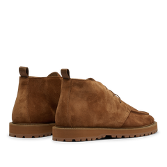 A pair of Cognac Suede Leather Astra Desert Boots by CQP, featuring rugged soles, pull tabs at the back, and a lace-up closure.