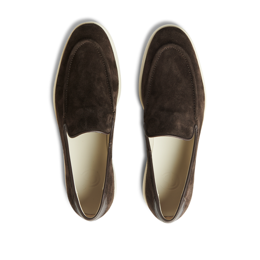 A pair of CQP chocolate brown suede leather Debonair slippers displayed on a transparent background.
