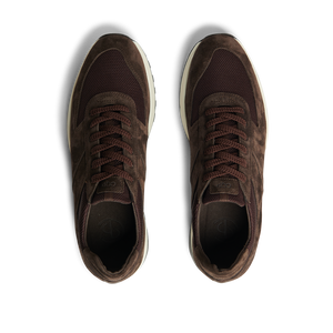 A pair of dark brown CQP Stride Runners on a white background.