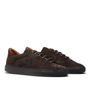 The CQP Ebony Brown Racquet Sr Sneakers feature dark brown suede calf leather with black rubber soles and matching dark brown laces, offering enhanced comfort and improved arch support.