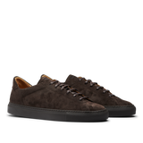 The CQP Ebony Brown Racquet Sr Sneakers feature dark brown suede calf leather with black rubber soles and matching dark brown laces, offering enhanced comfort and improved arch support.