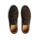 Top view of a pair of Ebony Brown Racquet Sr suede calf leather sneakers by CQP, featuring laces, a light brown inner lining, a black sole, and enhanced arch support.