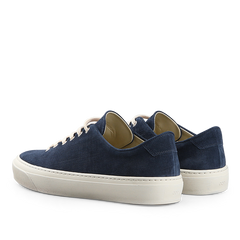 A pair of Indigo Blue Textured Suede Genoa Sneakers by CQP, featuring white rubber soles and light-colored laces, displayed from a rear angle.