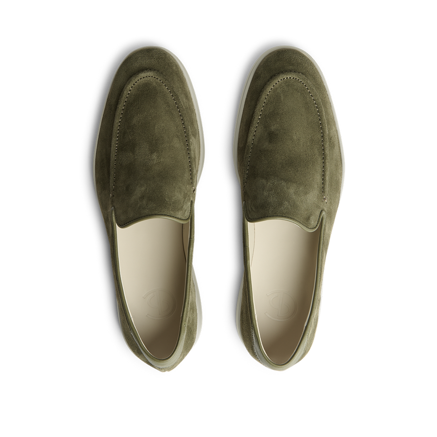 A pair of CQP Juniper Green Suede Leather Debonair Slippers with a rubber sole designed by a Swedish designer.