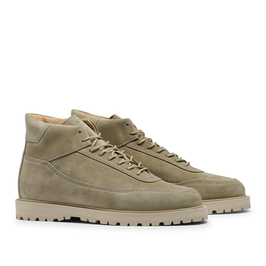 A pair of CQP Light Beige Suede Leather Sabulo Boots featuring a suede upper, white laces, and off-white rubber soles, displayed on a plain background.