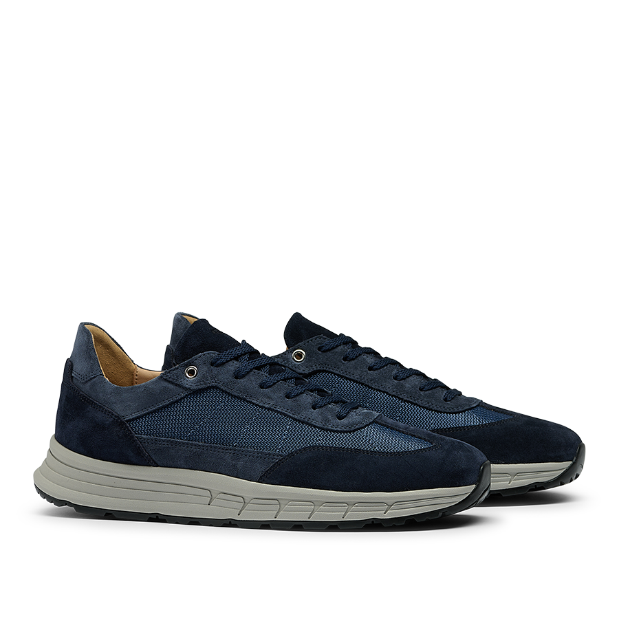 A pair of Navy Suede Leather Renna Mesh Sneakers from CQP, featuring navy blue suede leather with white soles, mesh detailing, and premium materials complemented by a VIBRAM sole for unparalleled comfort.