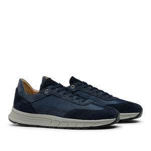 A pair of Navy Suede Leather Renna Mesh Sneakers from CQP, featuring navy blue suede leather with white soles, mesh detailing, and premium materials complemented by a VIBRAM sole for unparalleled comfort.