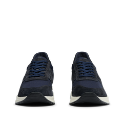 A pair of Obsidian Blue Suede Leather Stride Runners with white Gommus soles, viewed from the top on a transparent background by CQP.