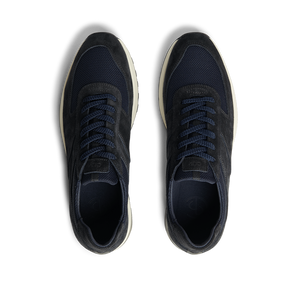 A classic pair of CQP Obsidian Blue Suede Stride Runners, perfect for everyday wear.