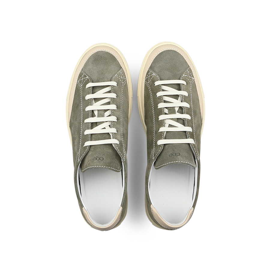 A pair of CQP's Olive Green Suede Leather Bumper Sneakers, featuring white laces and cream soles, is displayed from above on a white background.