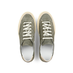 A pair of CQP's Olive Green Suede Leather Bumper Sneakers, featuring white laces and cream soles, is displayed from above on a white background.