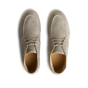 A pair of CQP Taupe Beige Suede Plana Boots, offering comfort, on a white background.