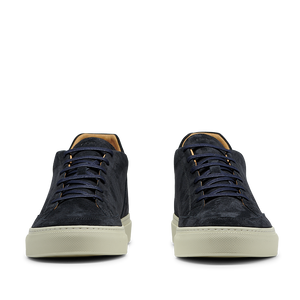 A pair of Prussian Blue Suede Leather Scion sneakers from CQP, with rubber soles, displayed against a transparent background.