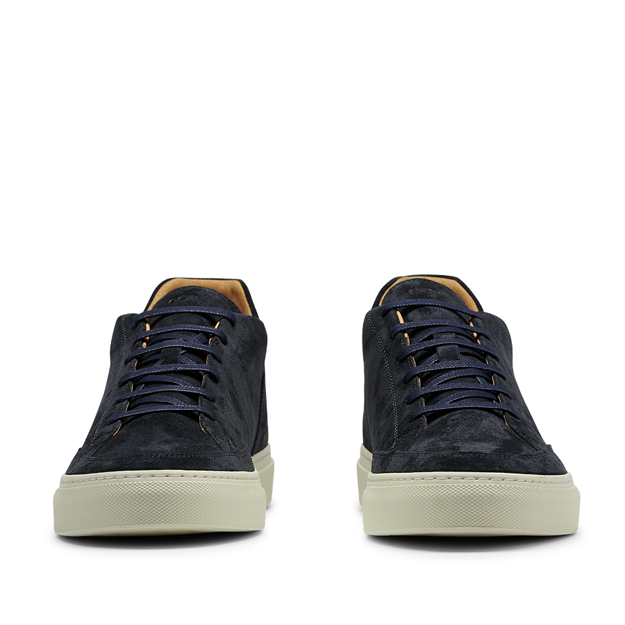 A pair of Prussian Blue Suede Leather Scion sneakers from CQP, with rubber soles, displayed against a transparent background.