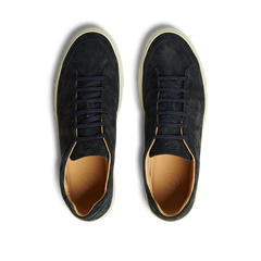 A pair of Prussian Blue Suede Leather Scion sneakers by CQP with matching laces and light brown inner soles, featuring a rubber sole, viewed from above on a transparent background.