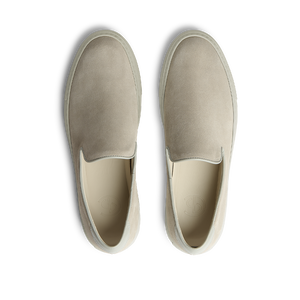 A pair of Sand Suede Jetty Wholecut Slip-on CQP shoes with a rubber sole displayed against a white background.