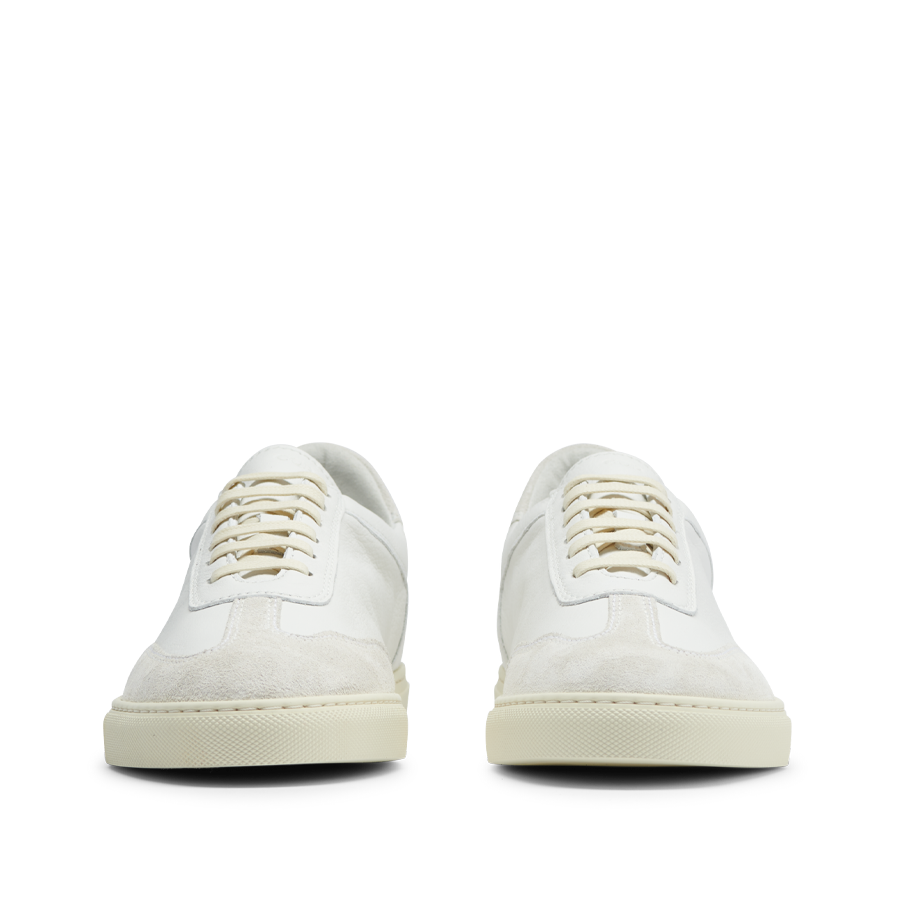 A pair of Seagull White Otium Leather Sneakers on a white background, handmade for comfort and style by CQP.
