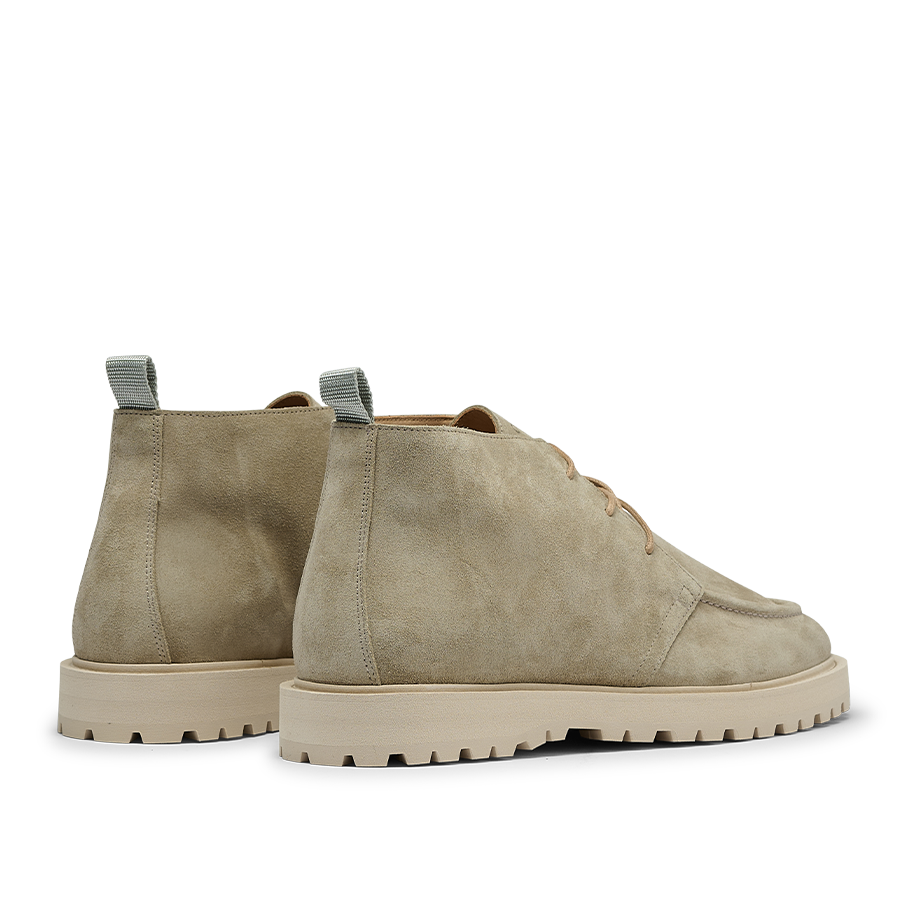 A pair of CQP Tan Beige Suede Leather Astra Boots, featuring tan laces, padded collars, and a supportive rubber sole crafted from rugged beige rubber, viewed from the back and side.