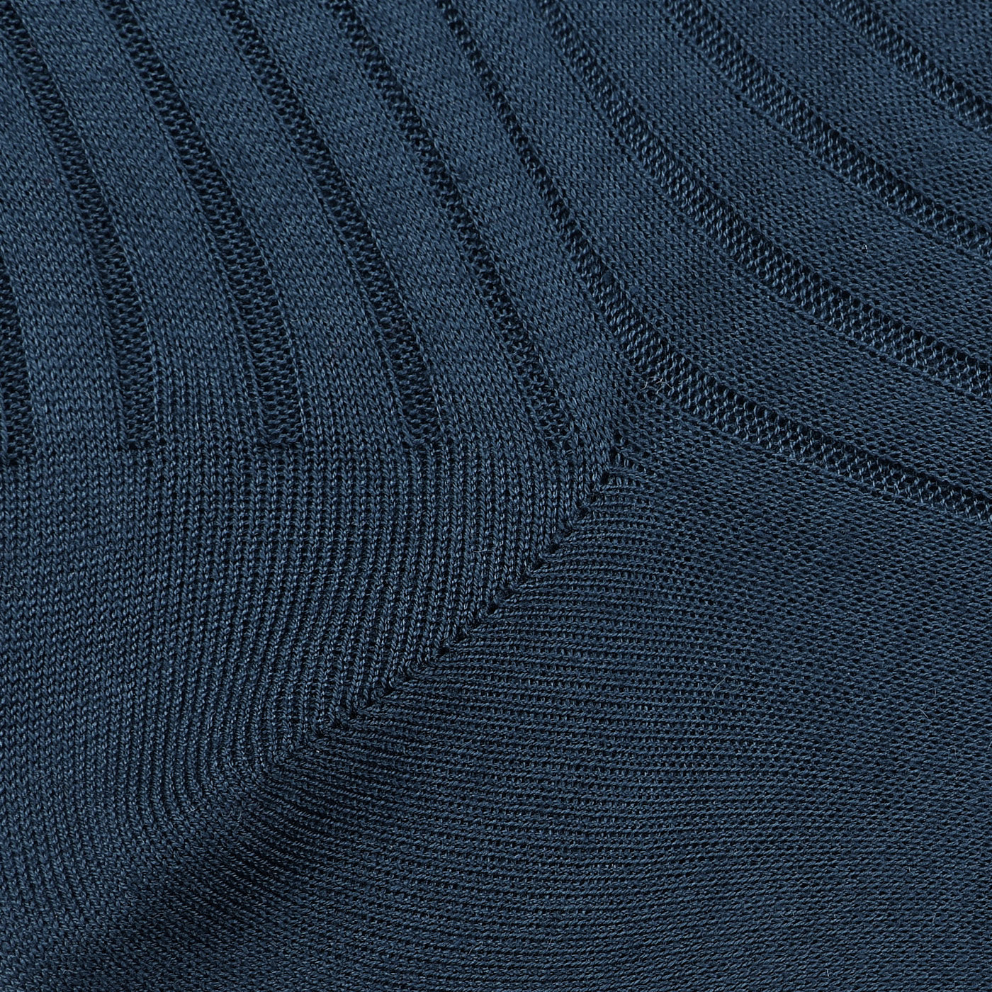 Close-up of the Airforce Blue Ribbed Cotton Socks by Canali, meticulously crafted from luxurious Egyptian cotton. The alternating ribbed and smooth textures create a geometric pattern, providing a seamless blend of luxury and comfort.