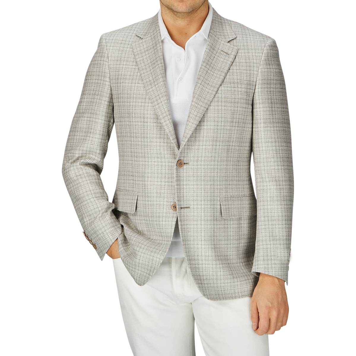 Man in a fitted beige melange silk wool basketweave blazer by Canali over a white shirt, with a partial view of white pants, standing against a grey background.