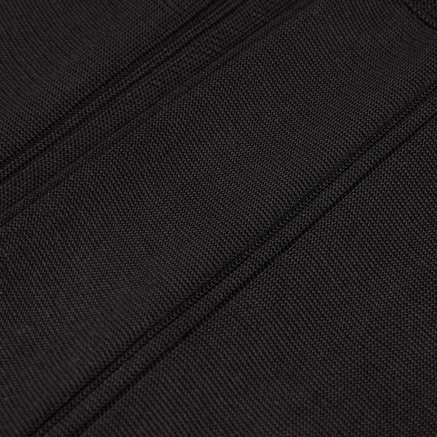 A close up image of a Canali black suitcase with pure silk lining.