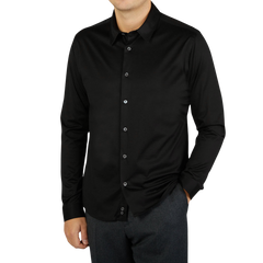 A contemporary man wearing a Canali Black Cotton Jersey Casual Shirt.