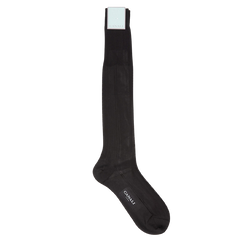 A pair of black knee length silk dress socks on a white background by Canali.