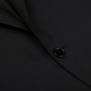 A close up of a timeless Canali Black Virgin Wool Twill Suit button.