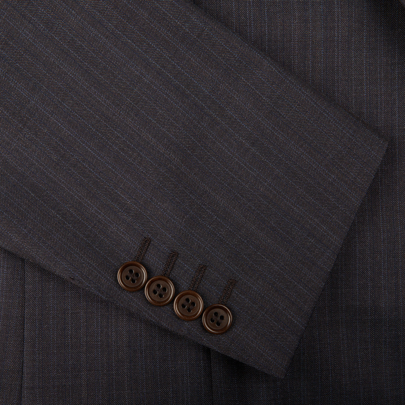 A close up of a Canali Blue Brown Melange Striped Wool Suit with buttons.