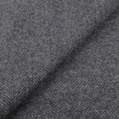 Close-up of the luxurious Blue Grey Herringbone Cashmere Scarf by Canali, showcasing its intricate pattern reminiscent of a fine piece.