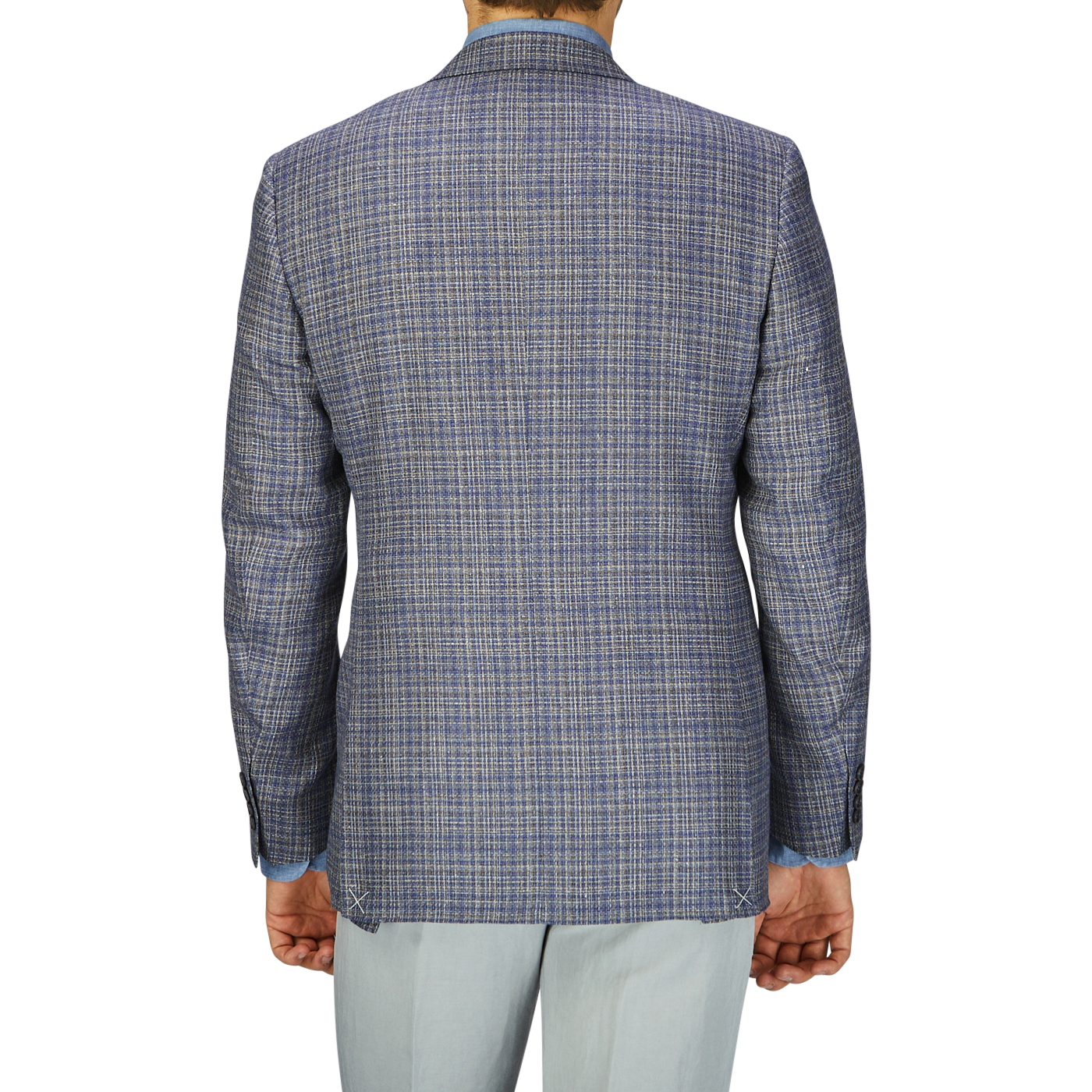 A man viewed from the back, wearing a Canali Blue Melange Silk Wool Basketweave Blazer and light-colored pants.