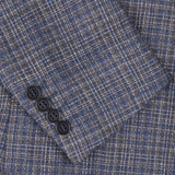 Close-up of a Canali Blue Melange Silk Wool Basketweave Blazer with a partial view of a garment collar and three black buttons.