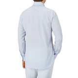 The back view of a Canali-clad man wearing a Blue Mini-Check Cotton Single Cuff Shirt and white pants from Italy.