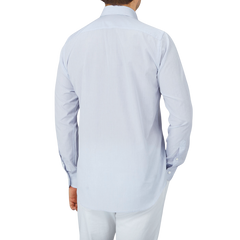 The back view of a Canali-clad man wearing a Blue Mini-Check Cotton Single Cuff Shirt and white pants from Italy.